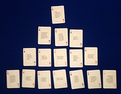 16 cards arranged in a bell curve